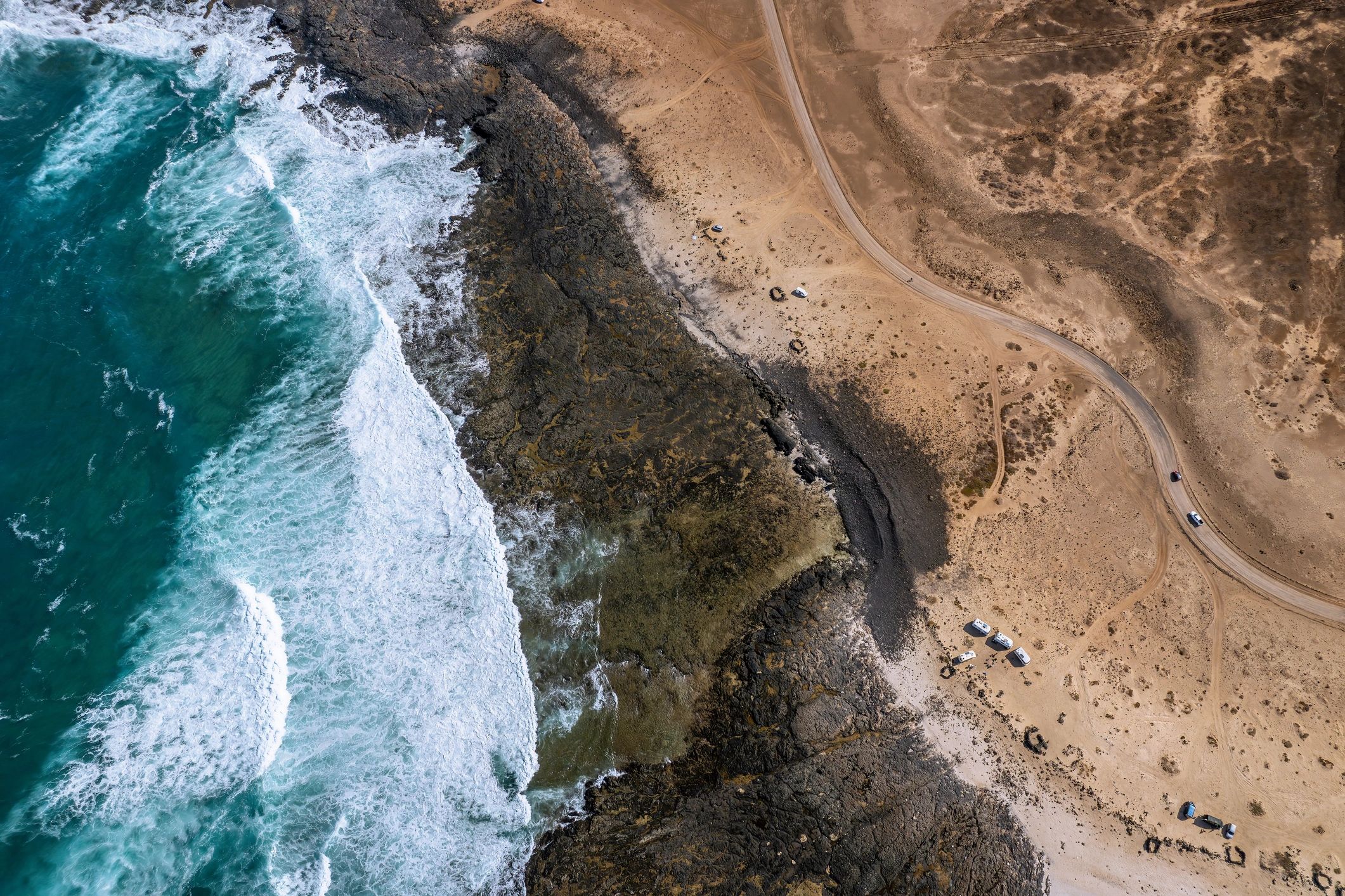 Aerial view of a beachside eco-lodge setting