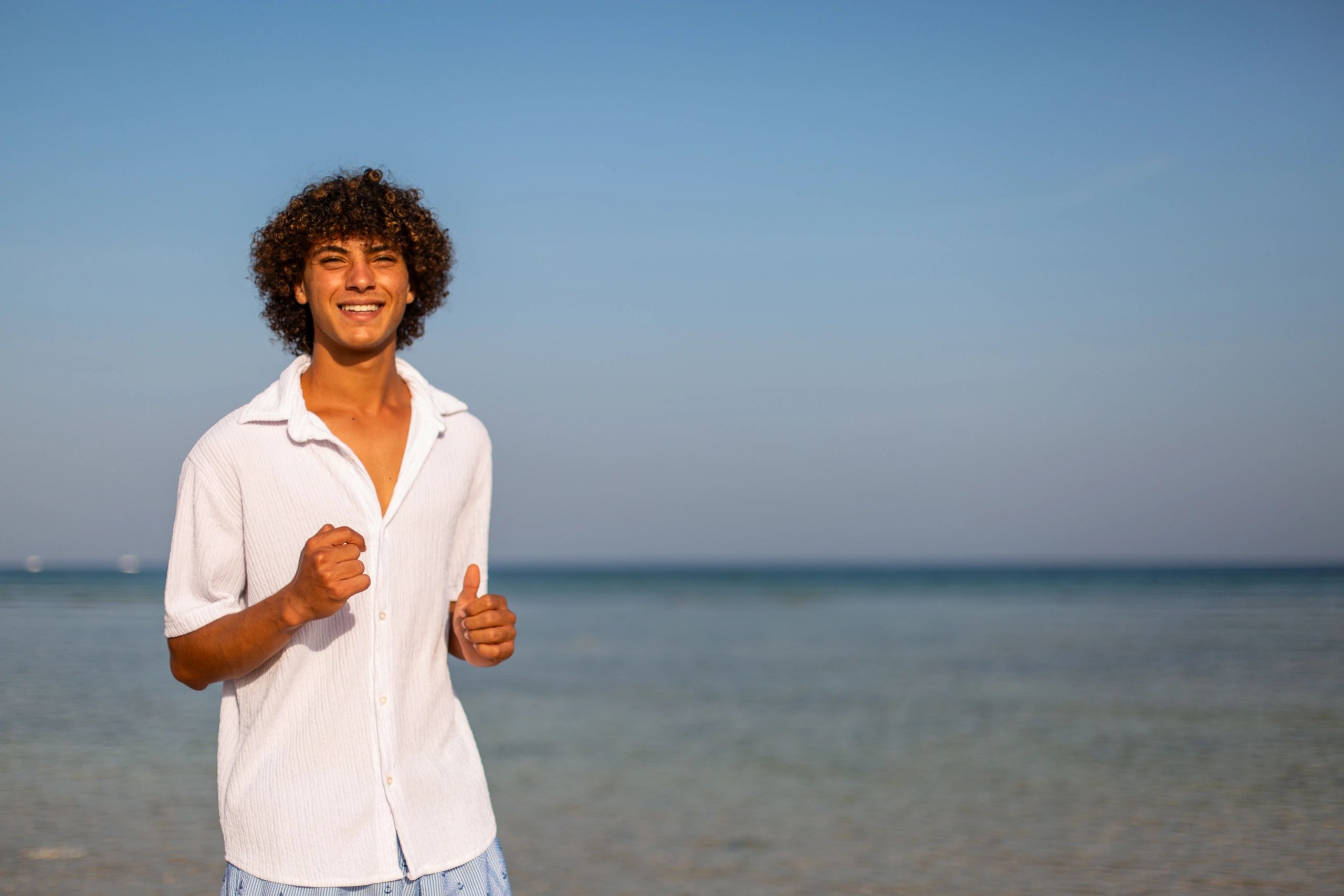 Guest enjoying a sunny beach resort setting